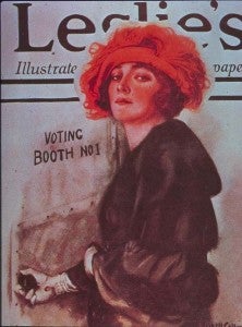 A well-dressed young woman enters “Voting Booth No. 1.”
